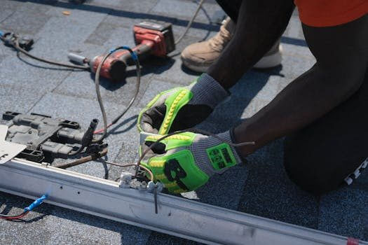 Technician installing solar panels on a roof in Tampa, showcasing clean energy efforts.