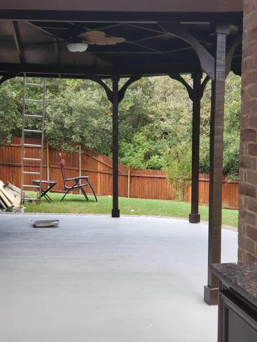 Finished covered patio structure with painted columns